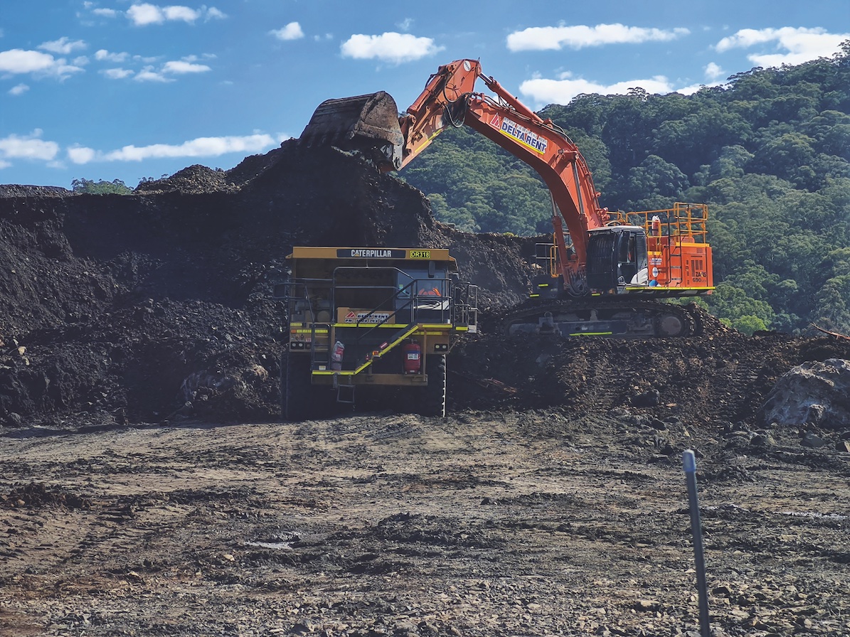 On loan: Delta’s Hitachi ZX690LCH-5 excavator fills the back of the Caterpillar 773 dump truck.